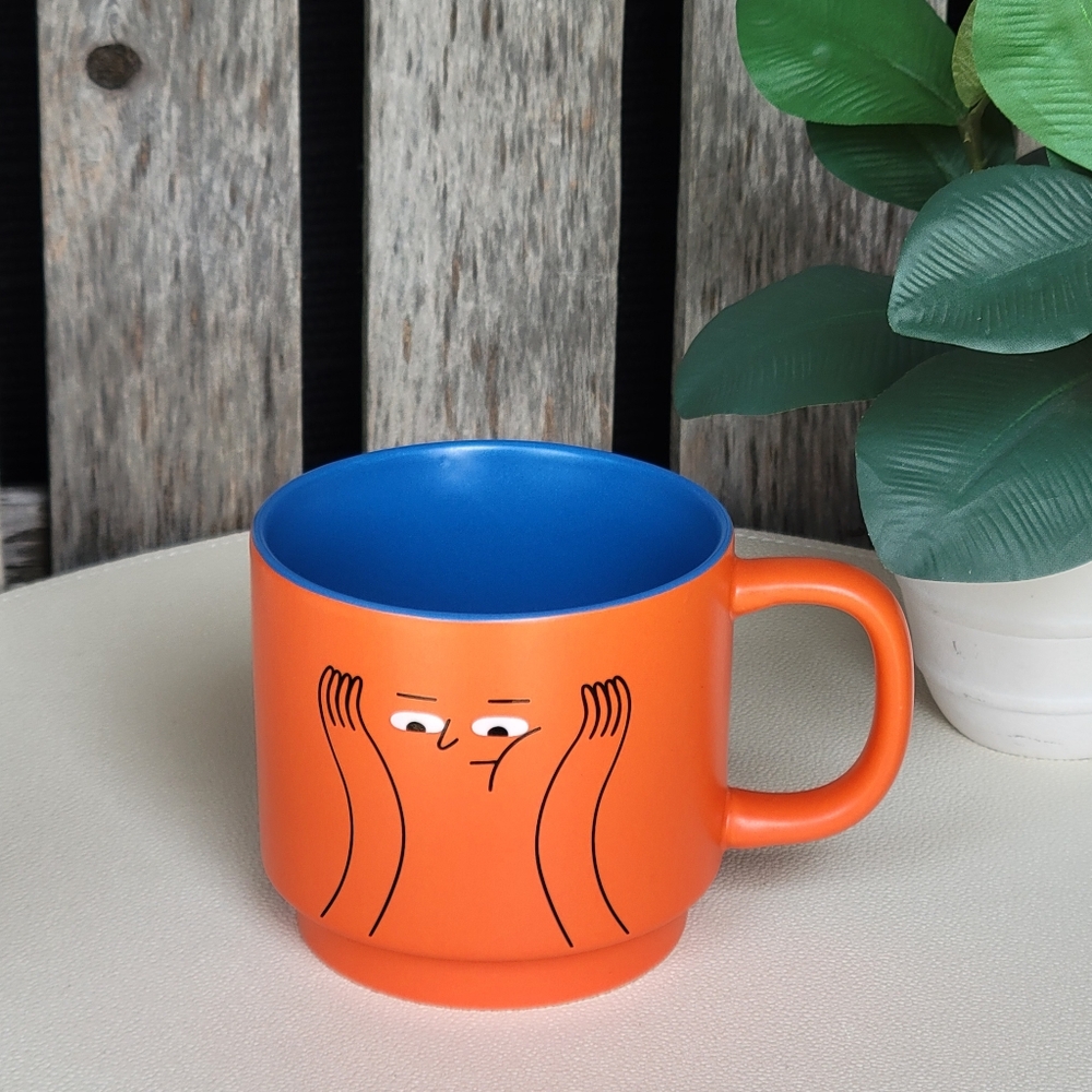 BKLYN Steel Co Orange Mug with Blue Interior and Whimsical Face Design
